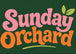 A square graphic with the words 'Sunday Orchard' in playful retro lettering on a dark green background. 'Sunday' is in pink, 'Orchard' is in orange, and there are two small green leaves above the 'y' in 'Sunday' and a light green underline beneath the text.